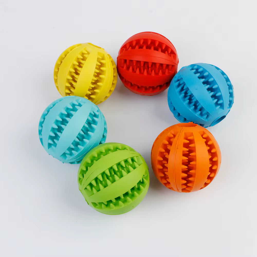 Colorful rubber balls with textured surfaces on a white background